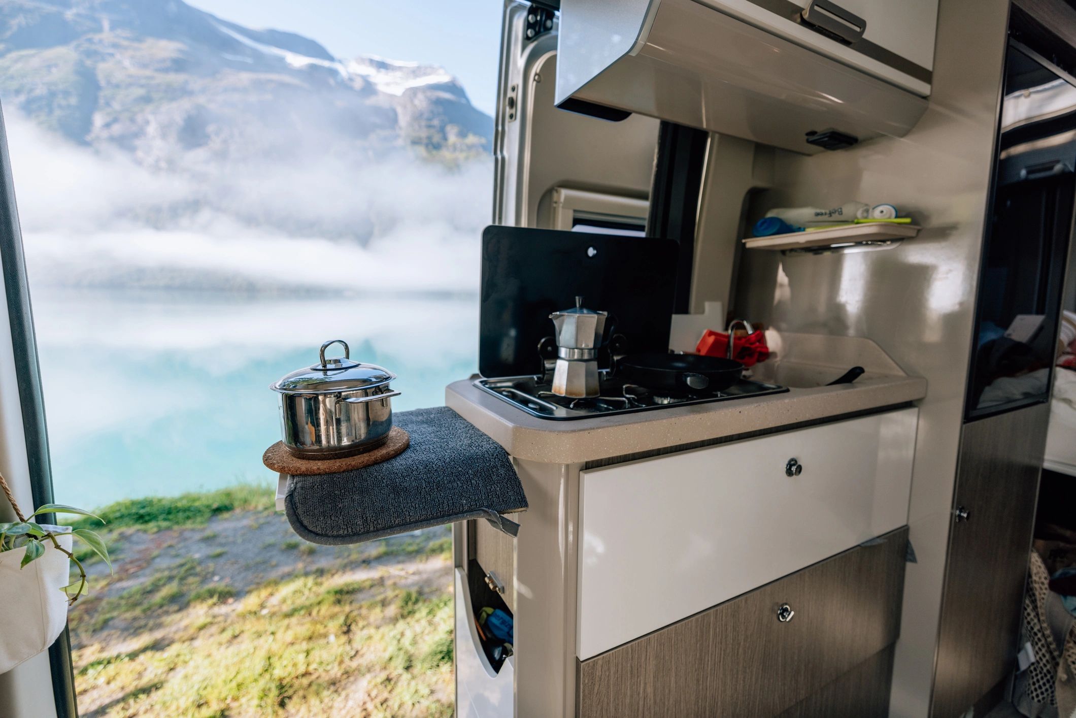 Campervan interior with lake view for travel planning inspiration